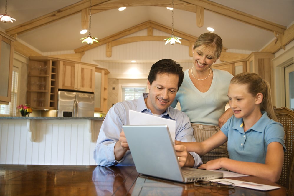 Family Paying Bills on Computer.